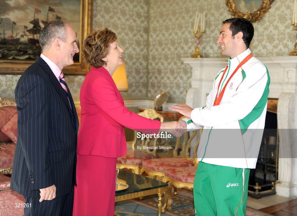 20 September 2008; Irish olympic boxer Kenny Egan is welcomed by President Mary McAleese and Dr. Martin McAleese during a reception for the Irish athletes, coaches and officials who represented Ireland at the Beijing Olympics, hosted by President Mary McAleese at Aras an Uachtaran. Irish Olympians visit Aras an Uachtarain, Phoenix Park, Dublin. Picture credit: Brendan Moran / SPORTSFILE