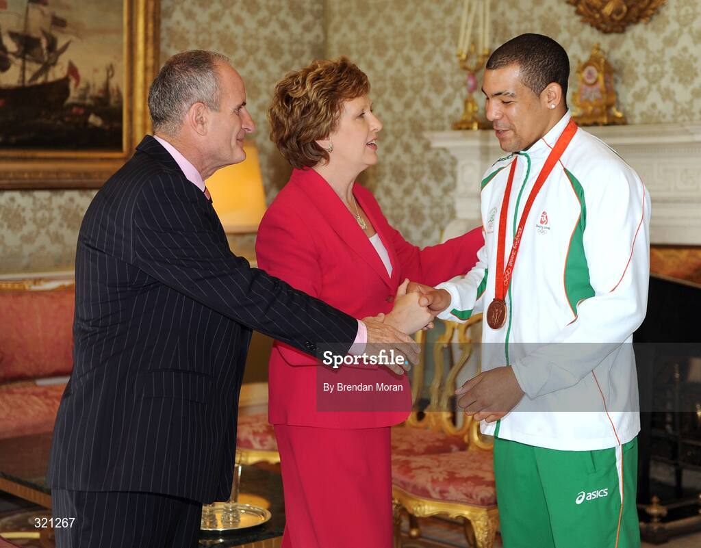 20 September 2008; Irish olympic boxer Darren Sutherland is welcomed by President Mary McAleese and Dr. Martin McAleese during a reception for the Irish athletes, coaches and officials who represented Ireland at the Beijing Olympics, hosted by President Mary McAleese at Aras an Uachtaran. Irish Olympians visit Aras an Uachtarain, Phoenix Park, Dublin. Picture credit: Brendan Moran / SPORTSFILE