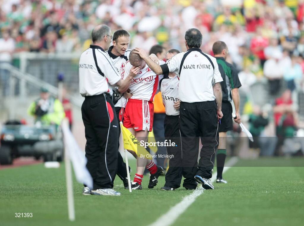 21 September 2008; Colm McCullagh, Tyrone, gets a pat on the head from assistant manager Tony Donnelly as he comes off injured. GAA Football All-Ireland Senior Championship Final, Kerry v Tyrone, Croke Park, Dublin. Picture credit: Oliver McVeigh / SPORTSFILE