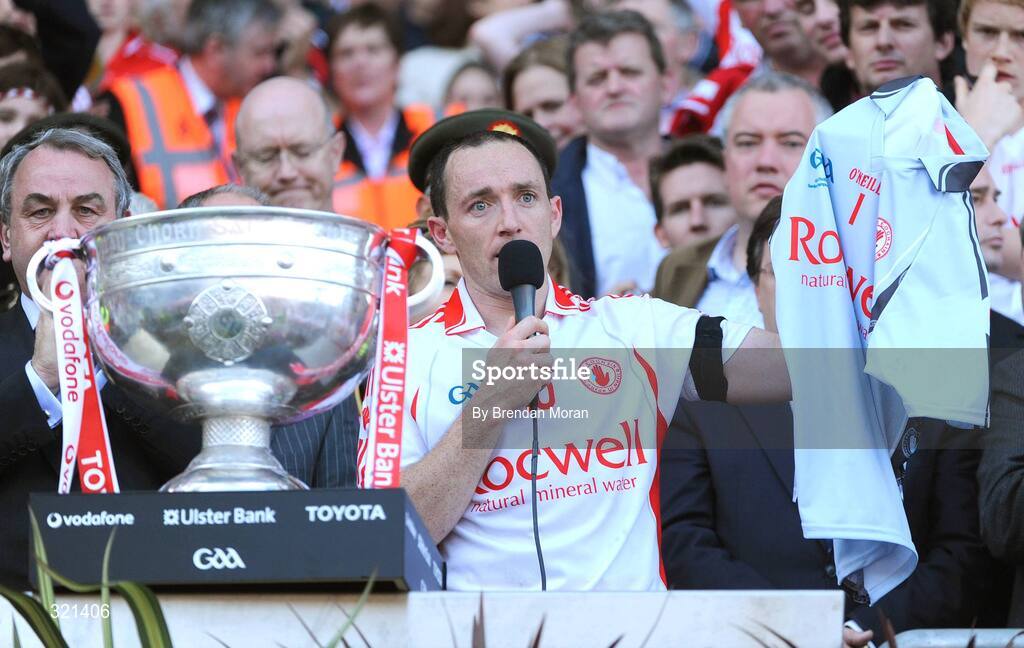 21 September 2008; Tyrone captain Brian Dooher holds up the jersey of team-mate John Devine, whose father passed away yesterday, after victory over Kerry. GAA Football All-Ireland Senior Championship Final, Kerry v Tyrone, Croke Park, Dublin. Picture credit: Brendan Moran / SPORTSFILE