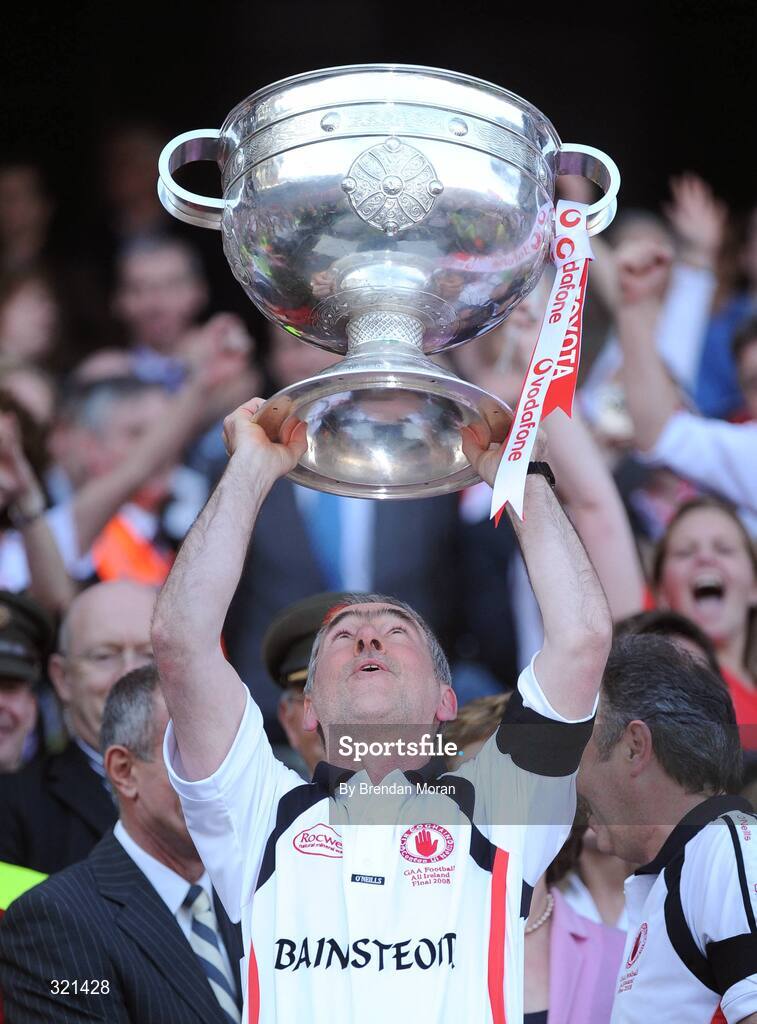 21 September 2008; Tyrone manager Mickey Harte lifts the Sam Magure Cup after victory over Kerry. GAA Football All-Ireland Senior Championship Final, Kerry v Tyrone, Croke Park, Dublin. Picture credit: Brendan Moran / SPORTSFILE