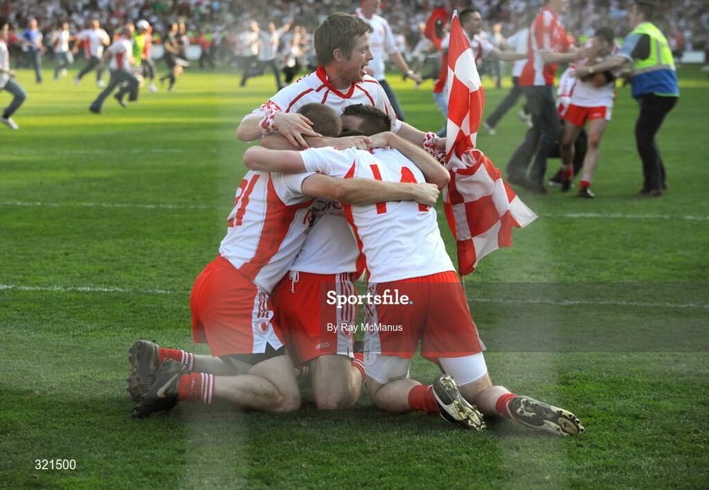 21 September 2008; Tyrone players Kevin Hughes, Brian McGuigan, Sean Cavanagh and a supporter celebrate at the final whistle. GAA Football All-Ireland Senior Championship Final, Kerry v Tyrone, Croke Park, Dublin. Picture credit: Ray McManus / SPORTSFILE