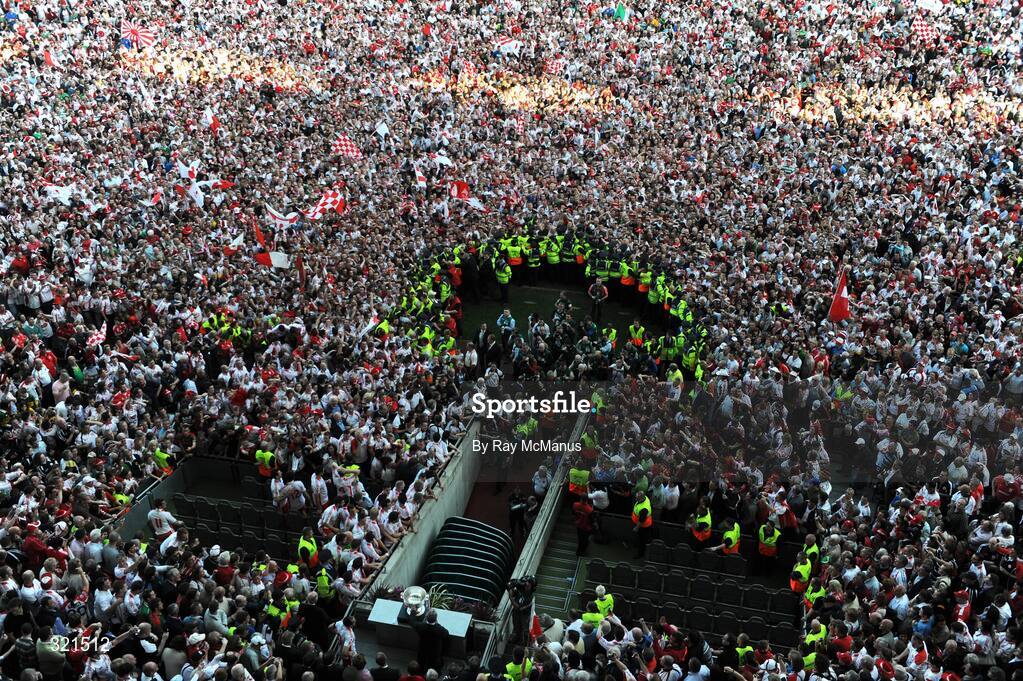 21 September 2008; GAA President Nickey Brennan prepares to present the Sam Maguire cup as the Tyrone supporters celebrate on the pitch. GAA Football All-Ireland Senior Championship Final, Kerry v Tyrone, Croke Park, Dublin. Picture credit: Ray McManus / SPORTSFILE