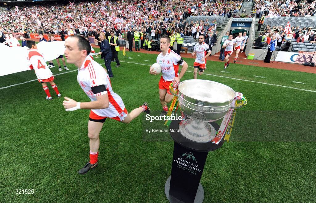 21 September 2008; Tyrone captain Brian Dooher runs past the Sam Magure Cup before the game. GAA Football All-Ireland Senior Championship Final, Kerry v Tyrone, Croke Park, Dublin. Picture credit: Brendan Moran / SPORTSFILE