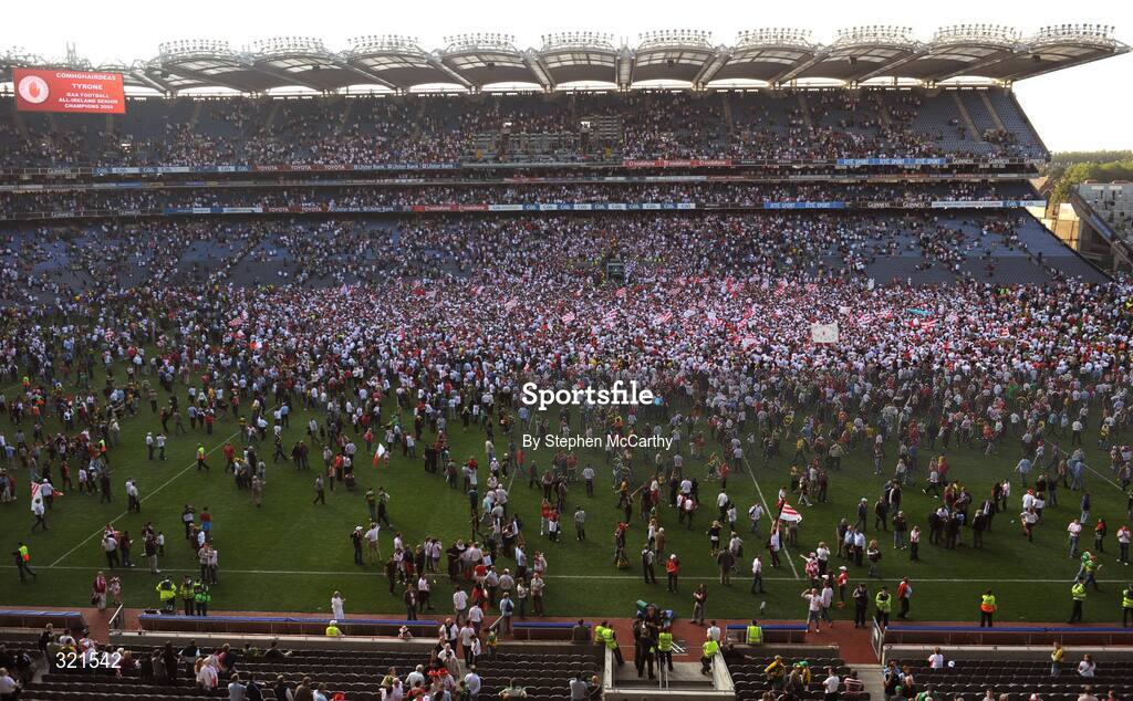 21 September 2008; Tyrone supporters watch on as captain Brian Dooher lifts the Sam Maguire cup. GAA Football All-Ireland Senior Championship Final, Kerry v Tyrone, Croke Park, Dublin. Picture credit: Stephen McCarthy / SPORTSFILE