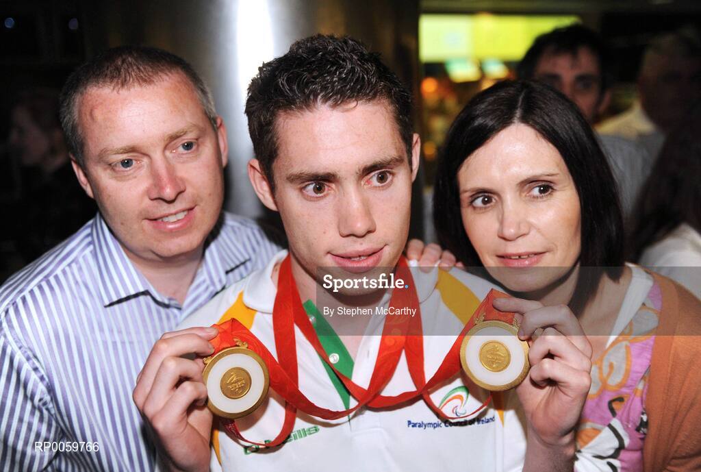 19 September 2008; Jason Smyth, from Eglinton, Co. Derry, who won two gold medals in the Men's 200m -T13 Final and Men's 100m T13 Final, with his parents Lloyd and Diane, at Dublin Airport as the Irish Paralympic Team arrived home from Beijing. Dublin Airport, Dublin. Picture credit: Stephen McCarthy / SPORTSFILE