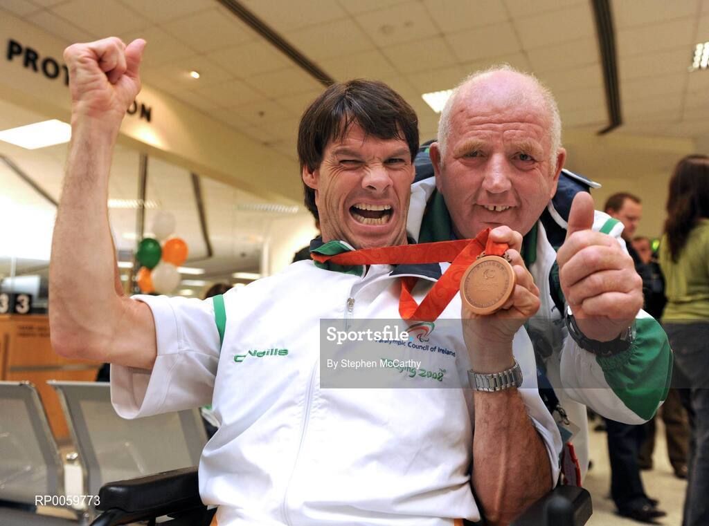 19 September 2008; Gabriel Shelly, from Bagenalstown, Co. Carlow, who won a bronze medal in the Boccia Mixed Individual - BC1, with Sports Assistant Patrick 'Rocky' Judge at Dublin Airport as the Irish Paralympic Team arrived home from Beijing. Dublin Airport, Dublin. Picture credit: Stephen McCarthy / SPORTSFILE