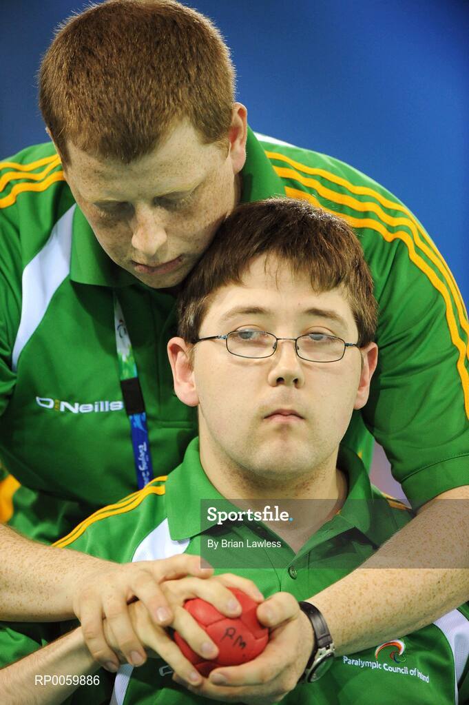 7 September 2008; Padraic Moran, from Bray, Co. Wicklow, with assistant Robert Roe, from Bray, Wicklow, during his opening pool match of the Individual Boccia competition against David Smith of Great Britain. Padraic won his match 9-0. Beijing Paralympic Games 2008, Mixed Individual Boccia BC1, Pool B, Fencing Hall of National Convention Centre, Olympic Green, Beijing, China. Picture credit: Brian Lawless / SPORTSFILE
