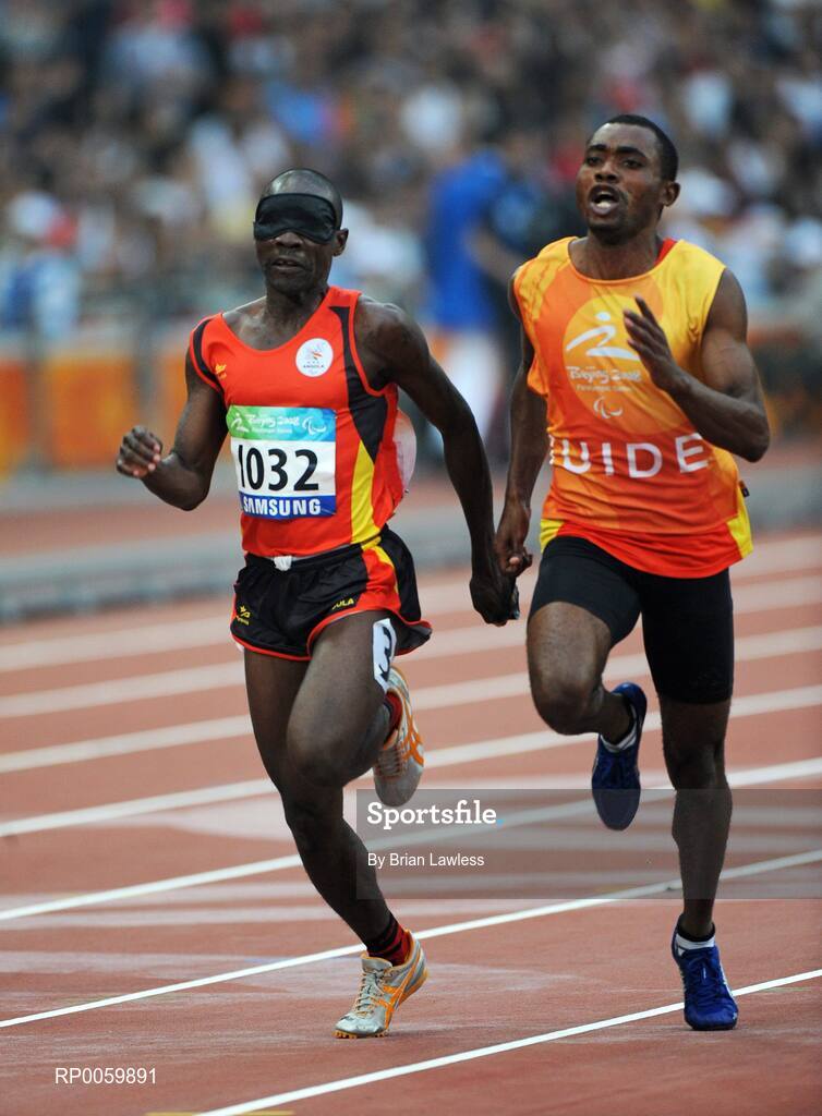 8 September 2008;  Angola's Miguel Francisco, left, runs with his guide during the Men's 100m - T11 Round 1 Heat 1. Beijing Paralympic Games 2008, Men's 100m - T11 Round 1 Heat 1, National Stadium, Olympic Green, Beijing, China. Picture credit: Brian Lawless / SPORTSFILE