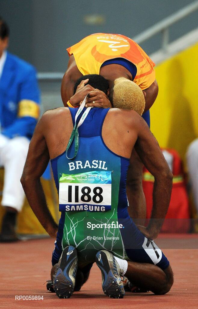 8 September 2008;  Brazil's Daniel Silva is consoled by his guide after failing to qualify during the Men's 100m - T11 Round 1 Heat 3. Beijing Paralympic Games 2008, Men's 100m - T11 Round 1 Heat 3, National Stadium, Olympic Green, Beijing, China. Picture credit: Brian Lawless / SPORTSFILE