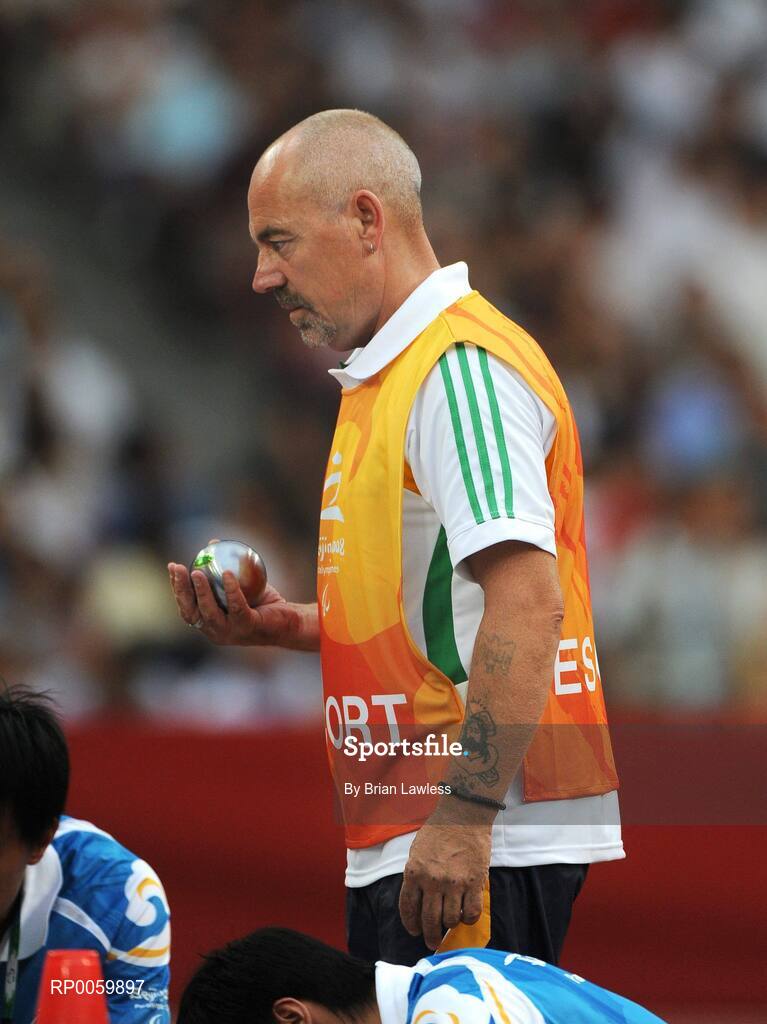 8 September 2008; Assistant Michael Bergin, from Wexford, during the Men's Shot Putt Final - F32. Beijing Paralympic Games 2008, Men's Shot Putt Final F32, National Stadium, Olympic Green, Beijing, China. Picture credit: Brian Lawless / SPORTSFILE
