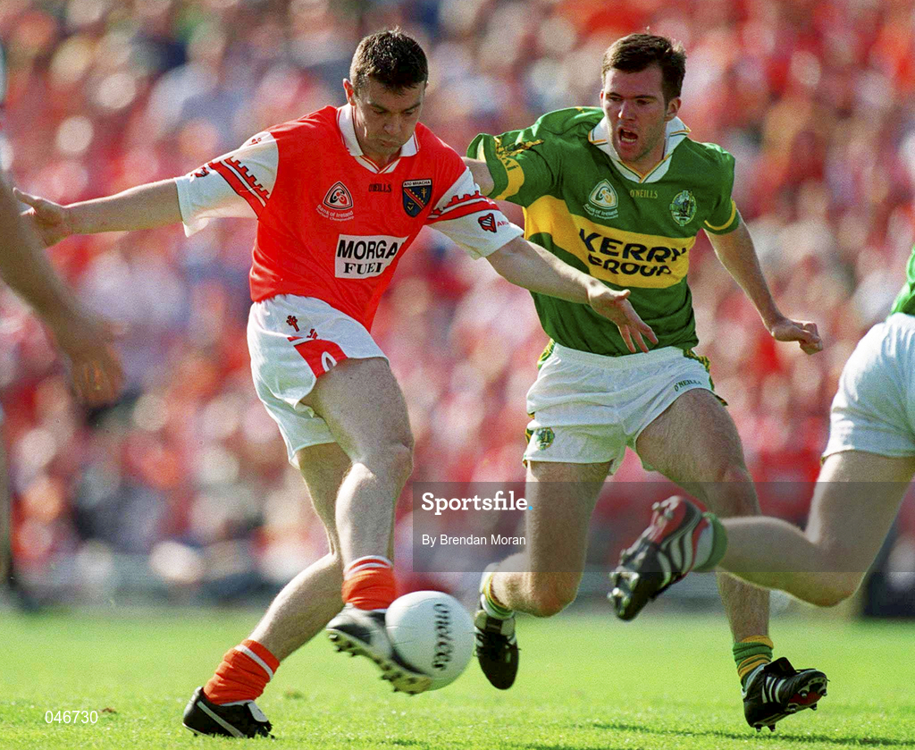 2 September 2000; Oisin McConville of Armagh scores a goal despite the attentions of Mike McCarthy of Kerry of Armagh during the Bank of Ireland All-Ireland Senior Football Championship Semi-Final replay match between Kerry and Armagh at Croke Park in Dublin. Photo by Brendan Moran/Sportsfile