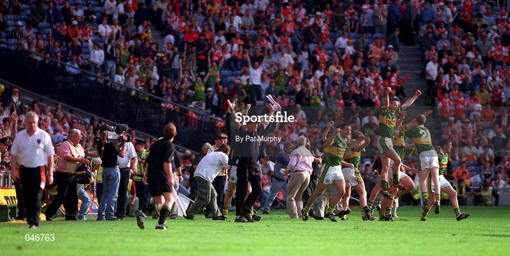 2 September 2000; Armagh co-manager Brian McAlinden, left, leaves the field while the Kerry players and officials celebrate after the Bank of Ireland All-Ireland Senior Football Championship Semi-Final replay match between Kerry and Armagh at Croke Park in Dublin. Photo by Pat Murphy/Sportsfile