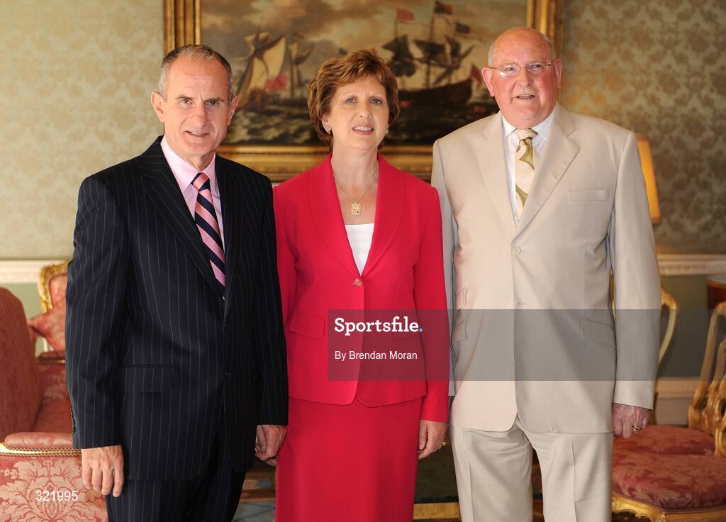 20 September 2008; Olympic Council of Ireland Honorary Treasurer Peadar Casey with President Mary McAleese and Dr. Martin McAleese during a reception for the Irish athletes, coaches and officials who represented Ireland at the Beijing Olympics, hosted by President Mary McAleese at Aras an Uachtaran. Irish Olympians visit Aras an Uachtarain, Phoenix Park, Dublin. Picture credit: Brendan Moran / SPORTSFILE