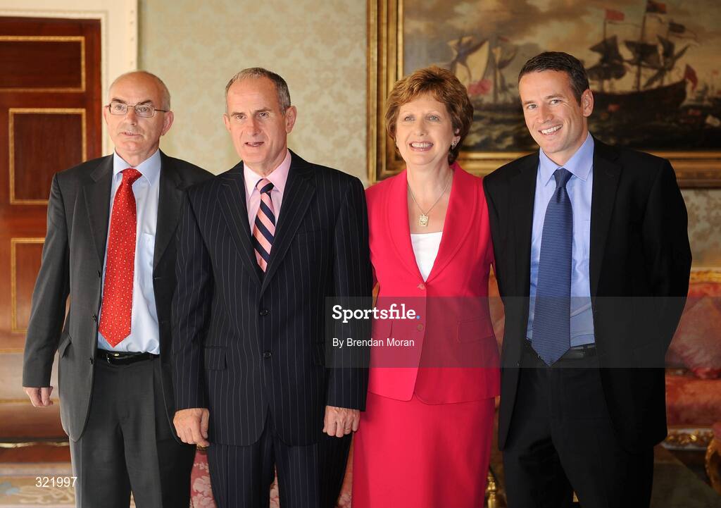 20 September 2008; Liam Hennessy, left, President of Athletics Ireland and Finbar Kirwan, Irish Sports Council with President Mary McAleese and Dr. Martin McAleese during a reception for the Irish athletes, coaches and officials who represented Ireland at the Beijing Olympics, hosted by President Mary McAleese at Aras an Uachtaran. Irish Olympians visit Aras an Uachtarain, Phoenix Park, Dublin. Picture credit: Brendan Moran / SPORTSFILE