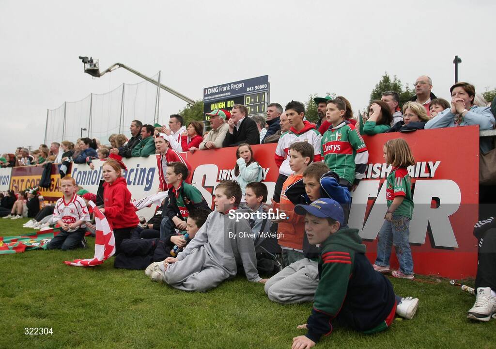 27 September 2008; Both Mayo and Tyrone supporters, forced to overflow onto the side of the pitch, watch the game. ESB GAA Football All-Ireland Minor Championship Final Replay, Tyrone v Mayo, Pearse Park, Longford. Picture credit: Oliver McVeigh / SPORTSFILE