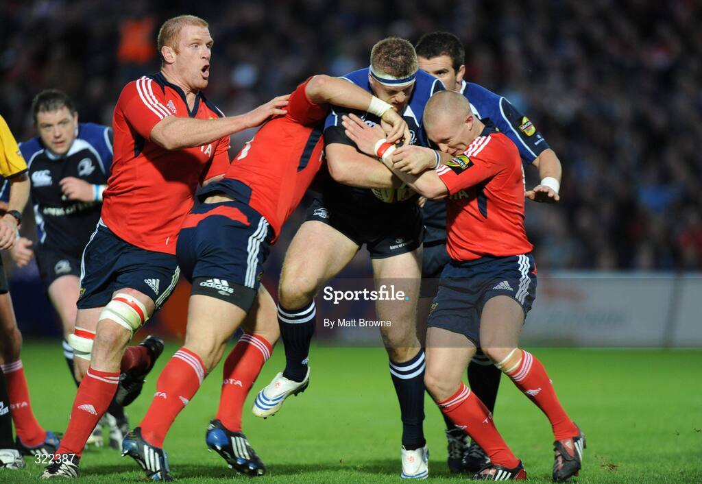 28 September 2008; Jamie Heaslip, Leinster, is tackled by Keith Earls, David Wallace and Paul O'Connell, Munster. Magners League, Leinster v Munster, RDS, Dublin. Picture credit: Matt Browne / SPORTSFILE