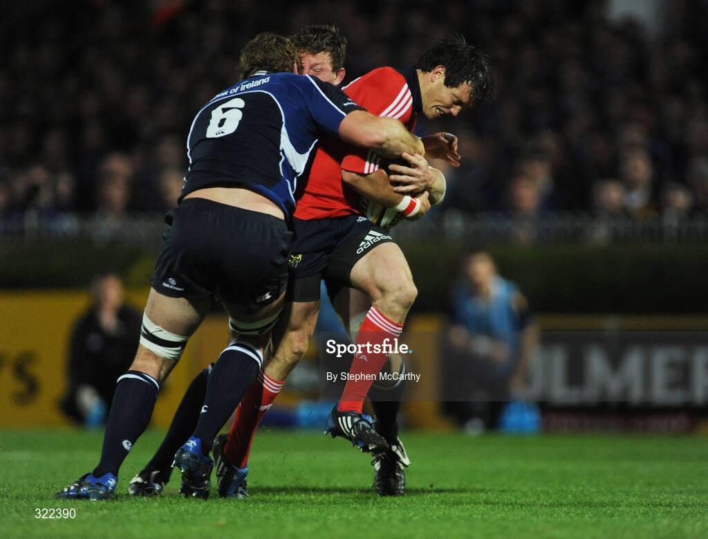 28 September 2008; Ian Dowling, Munster, is tackled by Rocky Elsom, 6, and Malcolm O'Kelly, Leinster. Magners League, Leinster v Munster, RDS, Dublin. Picture credit: Stephen McCarthy / SPORTSFILE