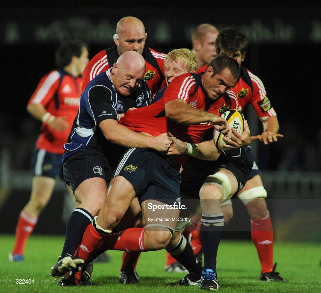 28 September 2008; Justin Melck, Munster, is tackled by Bernard Jackman, left, and Leo Cullen, Leinster. Magners League, Leinster v Munster, RDS, Dublin. Picture credit: Stephen McCarthy / SPORTSFILE