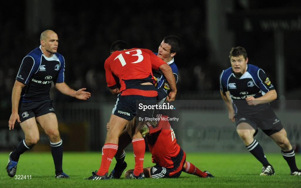 28 September 2008; Jonathan Sexton, Leinster, is tackled by Rua Tipoki, 13, and Ian Dowling, Munster, as team-mates Felipe Contepomi, left, and Brian O'Driscoll look on. Magners League, Leinster v Munster, RDS, Dublin. Picture credit: Stephen McCarthy / SPORTSFILE