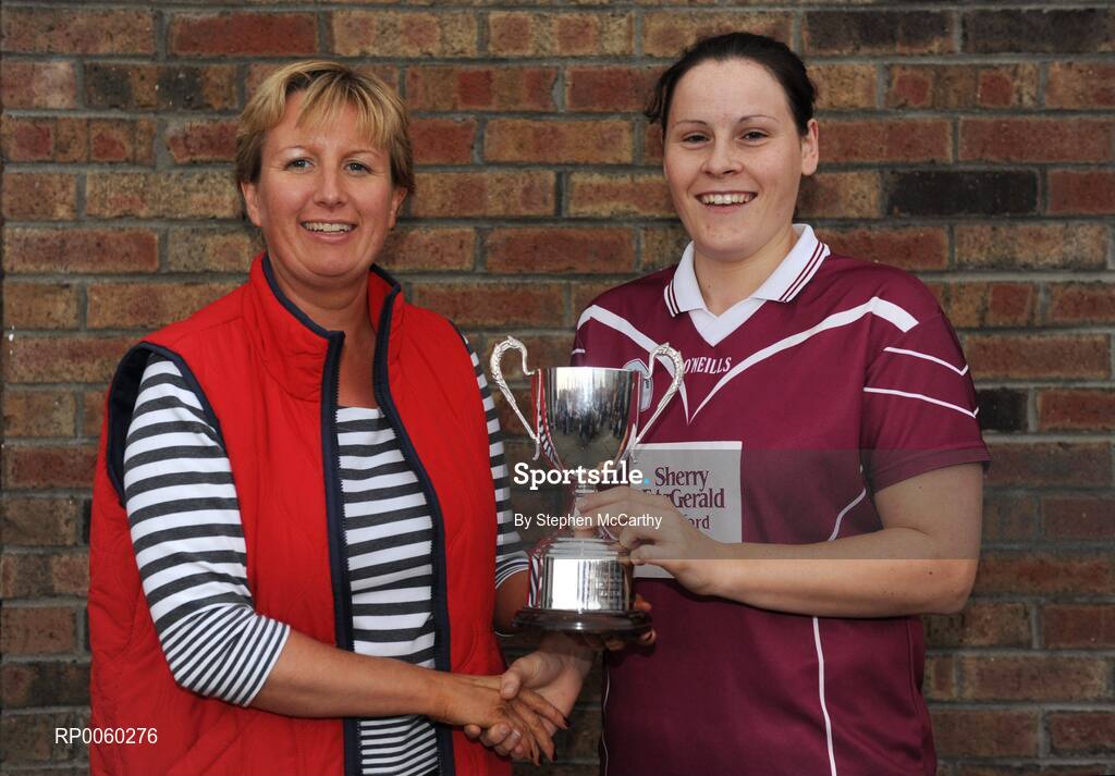 27 September 2008; Geraldine Giles, Uachtaran Cumman Peil Gael na mBan, presents Lynda Waters, St. Martin's, Wexford, with the Junior Shield Championship trophy. All-Ireland Ladies Football 7's, Naomh Mearnog, Portmarnock, Dublin. Picture credit: Stephen McCarthy / SPORTSFILE