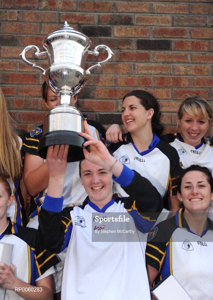 27 September 2008; Cliodhna O'Connor, Naomh Mearnog/St. Sylvester's, Dublin, lifts the Senior Championship trophy surrounded by team-mates. All-Ireland Ladies Football 7's, Naomh Mearnog, Portmarnock, Dublin. Picture credit: Stephen McCarthy / SPORTSFILE