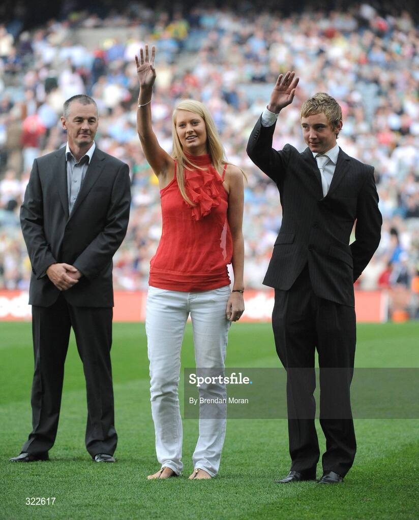 21 September 2008; Jodie and Patrick Holden, daughter and son of the late Mick Holden, wave to the crowd during the 1983 Dublin All-Ireland winning team presentation before the game. GAA Football All-Ireland Senior Championship Final, Kerry v Tyrone, Croke Park, Dublin. Picture credit: Brendan Moran / SPORTSFILE