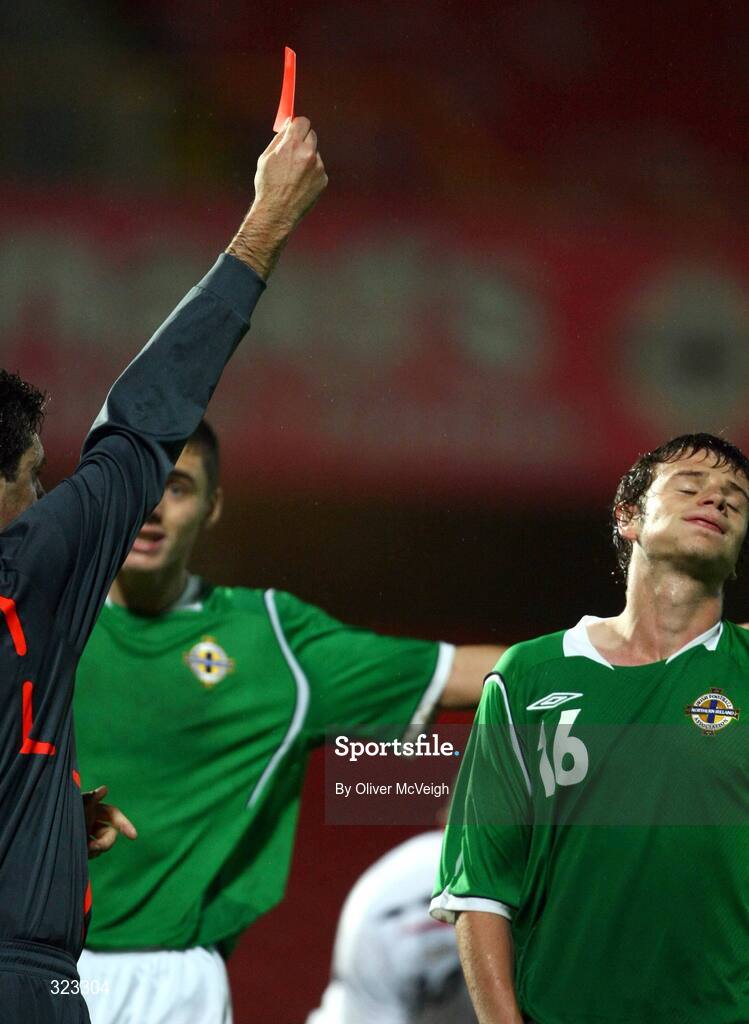 10 October 2008; Russian referee Alex Nikolaev sends off Northern Ireland's Nathan Hanley for a deliberate hand ball. UEFA Under 19 European Championships Qualifying Round, Northern Ireland v England, Windsor Park, Belfast. Picture credit: Oliver McVeigh / SPORTSFILE