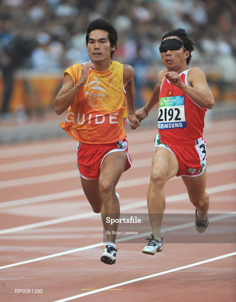 8 September 2008; Vietnam's Cuong Van Dao and his guide in action during the Men's 100m - T11. Beijing Paralympic Games 2008, National Stadium, Olympic Green, Beijing, China. Picture credit: Brian Lawless / SPORTSFILE