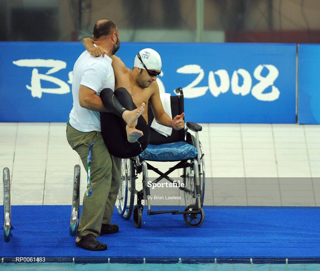 13 September 2008; Israel's Iyad Shalabi is assisted after competing in the Men's 50m Freestyle - S2 Heat. Beijing Paralympic Games 2008, National Aquatic Centre, Olympic Green, Beijing, China. Picture credit: Brian Lawless / SPORTSFILE