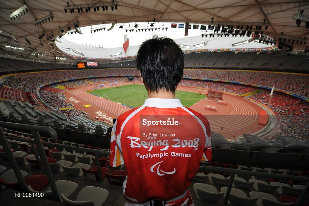 13 September 2008; A volunteer awaits the start of the days events. Beijing Paralympic Games 2008, National Stadium, Olympic Green, Beijing, China. Picture credit: Brian Lawless / SPORTSFILE