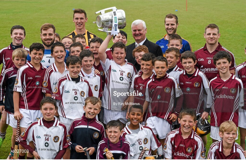 14 July 2015; Twelve year old Andrew Brennan Smyth, from the Village in Kilkenny, but a member of the Dicksboro GAA Club, lifts the Liam MacCarthy Cup as he and his club mates assemble with Uachtarán Chumann Lúthchleas Gael Aogán Ó Fearghail, GAA stars  Noel Connors, Waterford, Cillian Buckley, Kilkenny, Kieran Bergin, Tipperary, and Andy Smith, Galway, at the launch of the GAA Hurling All-Ireland Senior Championship Series 2015. Dicksboro GAA Club, Kilkenny. Picture credit: Ray McManus / SPORTSFILE