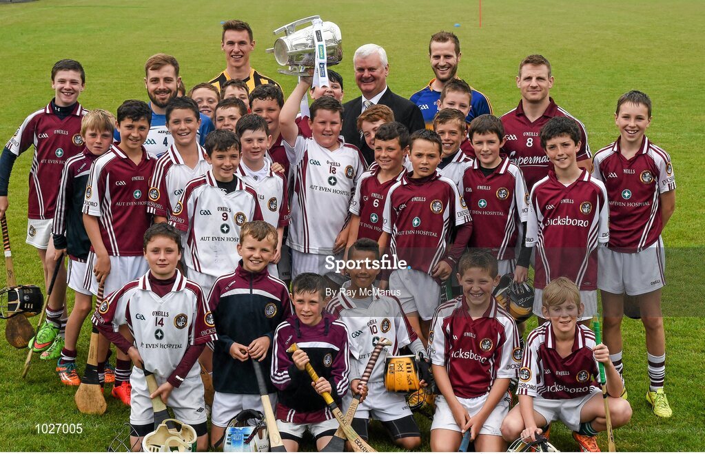 14 July 2015; Twelve year old Andrew Brennan Smyth, from the Village, in Kilkenny, but a member of the Dicksboro GAA Club, lifts the Liam MacCarthy Cup as he and his club mates assemble with Uachtarán Chumann Lúthchleas Gael Aogán Ó Fearghail, GAA stars  Noel Connors, Waterford, Cillian Buckley, Kilkenny, Kieran Bergin, Tipperary, and Andy Smith, Galway, at the launch of the GAA Hurling All-Ireland Senior Championship Series 2015. Dicksboro GAA Club, Kilkenny. Picture credit: Ray McManus / SPORTSFILE