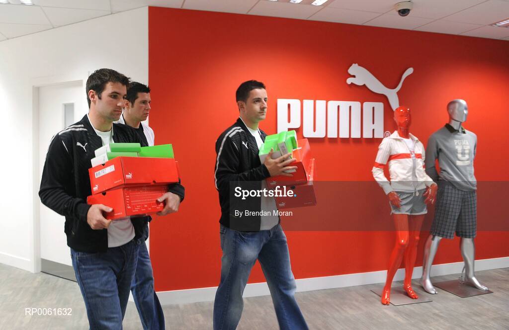 15 October 2008; The world's fastest growing sports-lifestyle brand, PUMA, has unveiled it's football boot and bodywear sponsorship of the Ireland Combined Rules team who travel to Australia this weekend for two Test matches against the hosts in Perth and Melbourne. Pictured carrying some of the gear for the team are, from left, Bryan Cullen of Dublin, Sean Cavanagh of Tyrone and Aidan O'Mahony of Kerry. Picture credit: Brendan Moran / SPORTSFILE