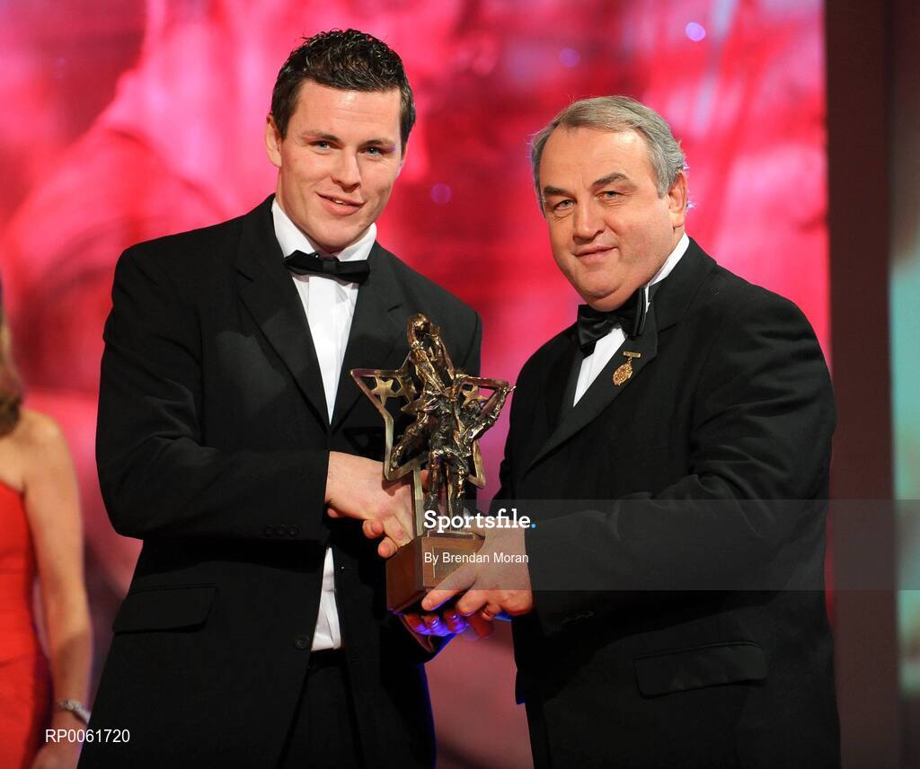 17 October 2008; Conor Gormley of Tyrone is presented with his GAA All-Star award by Nickey Brennan, GAA President, during the 2008 GAA All-Stars sponsored by Vodafone. Citywest Hotel, Conference, Leisure & Golf Resort, Dublin. Picture credit: Brendan Moran / SPORTSFILE