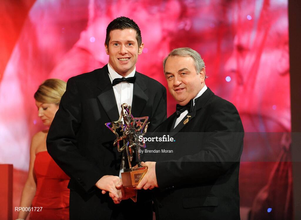 17 October 2008; Sean Cavanagh of Tyrone is presented with his GAA All-Star award by Nickey Brennan, GAA President, during the 2008 GAA All-Stars sponsored by Vodafone. Citywest Hotel, Conference, Leisure & Golf Resort, Dublin. Picture credit: Brendan Moran / SPORTSFILE