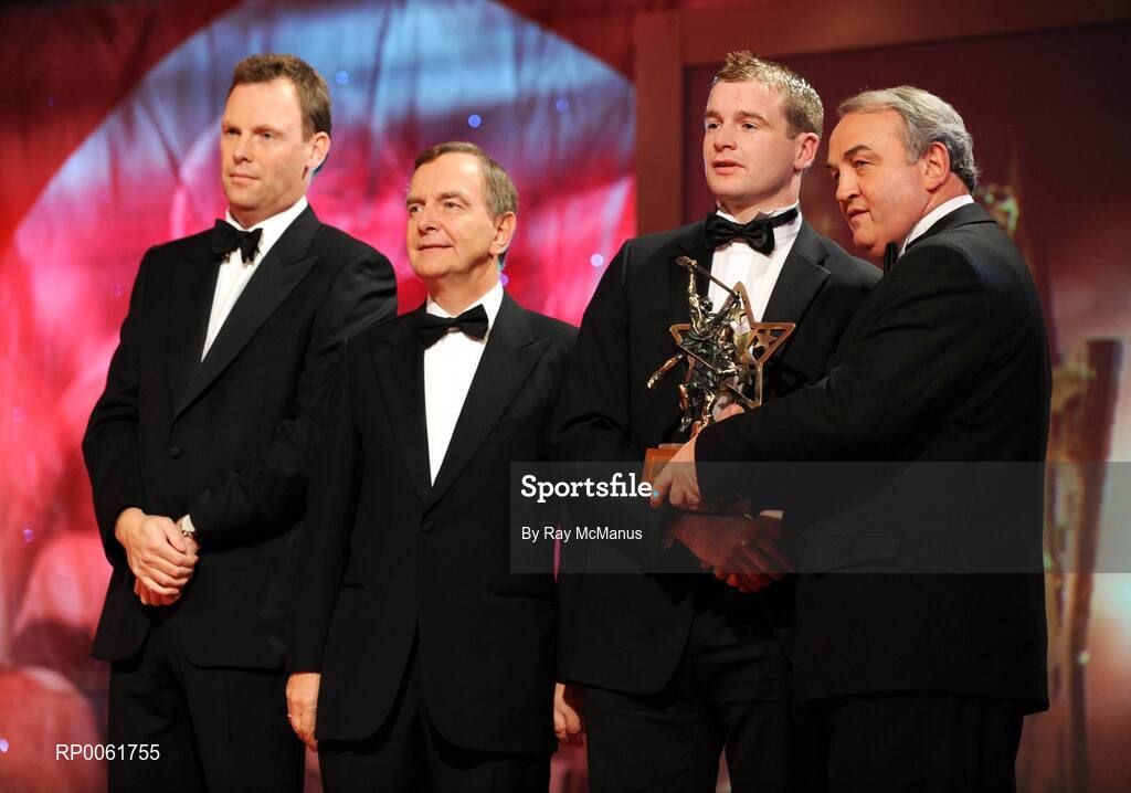 17 October 2008; JJ Delaney of Kilkenny is presented with his GAA All-Star award by Nickey Brennan, GAA President, in the company of Minister for Arts, Sport and Tourism, Martin Cullen T.D., and Charles Butterworth, CEO Vodafone Ireland, left, during the 2008 GAA All-Stars sponsored by Vodafone. Citywest Hotel, Conference, Leisure & Golf Resort, Dublin. Picture credit: Ray McManus / SPORTSFILE