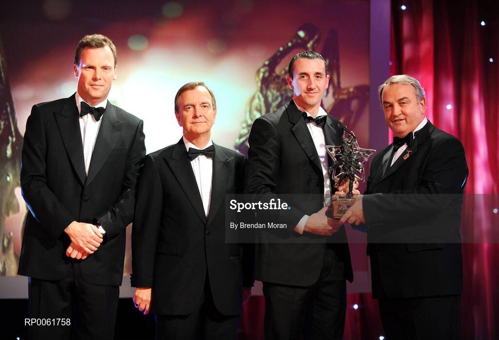 17 October 2008; Eoin Larkin of Kilkenny is presented with his GAA All-Star Hurler of the Year award by Nickey Brennan, GAA President, in the company of Minister for Arts, Sport and Tourism, Martin Cullen T.D., and Charles Butterworth, CEO Vodafone Ireland, left, during the 2008 GAA All-Stars sponsored by Vodafone. Citywest Hotel, Conference, Leisure & Golf Resort, Dublin. Picture credit: Brendan Moran / SPORTSFILE