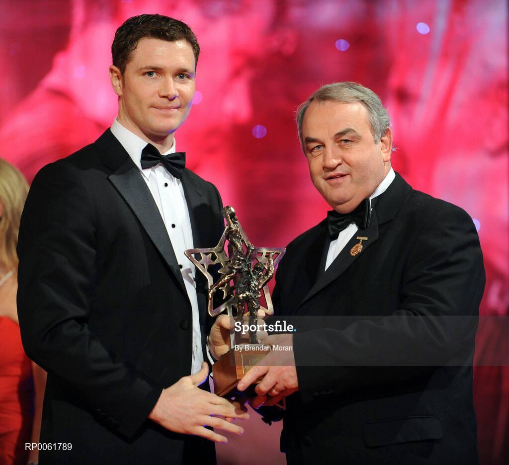 17 October 2008; Enda McGinley of Tyrone is presented with his GAA All-Star award by Nickey Brennan, GAA President, during the 2008 GAA All-Stars sponsored by Vodafone. Citywest Hotel, Conference, Leisure & Golf Resort, Dublin. Picture credit: Brendan Moran / SPORTSFILE