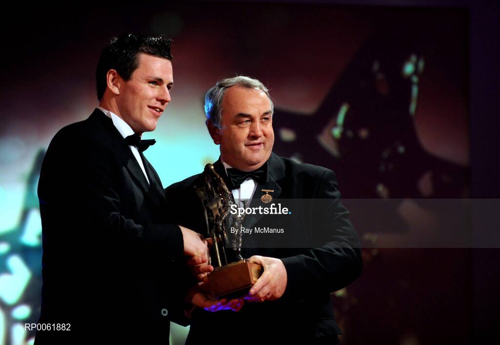 17 October 2008; Conor Gormley of Tyrone is presented with his GAA All-Star award by Nickey Brennan, GAA President, during the 2008 GAA All-Stars sponsored by Vodafone. Citywest Hotel, Conference, Leisure & Golf Resort, Dublin. Picture credit: Ray McManus / SPORTSFILE