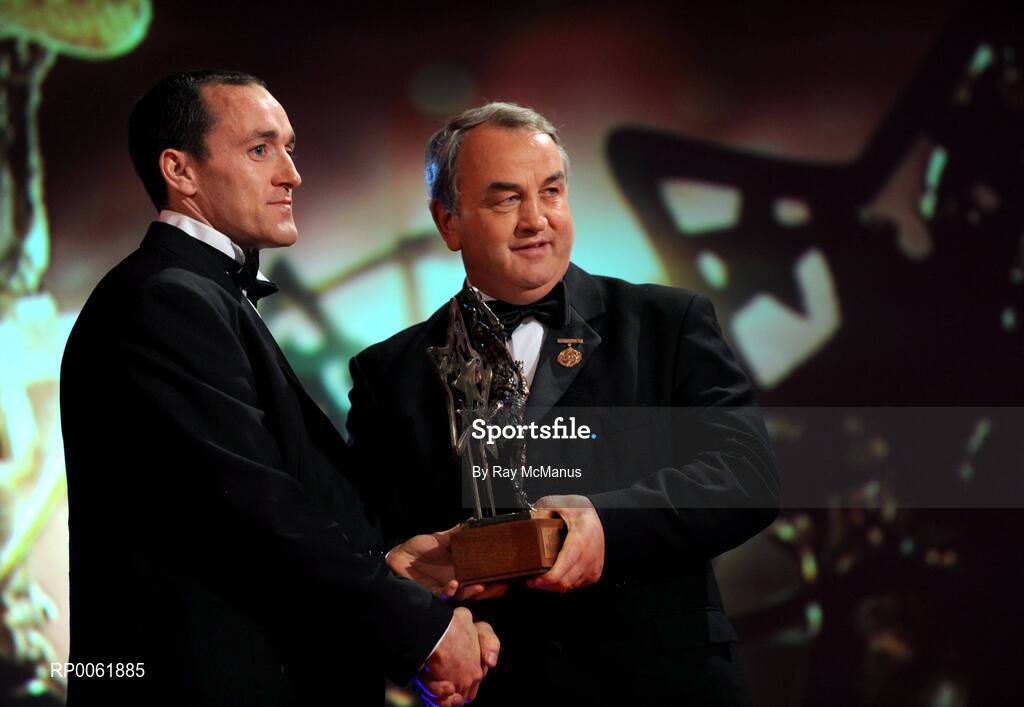 17 October 2008; Brian Dooher of Tyrone is presented with his GAA All-Star award by Nickey Brennan, GAA President, during the 2008 GAA All-Stars sponsored by Vodafone. Citywest Hotel, Conference, Leisure & Golf Resort, Dublin. Picture credit: Ray McManus / SPORTSFILE