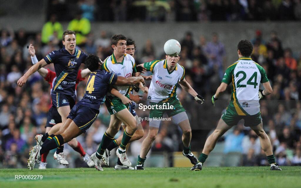 24 October 2008; Ireland's Colm Begley releases the ball to team-mate Tom parsons as he is tackled by Australia's David Rodan. 2008 Toyota International Rules Series, Australia v Ireland, Subiaco Oval, Perth, Western Australia. Picture credit: Ray McManus / SPORTSFILE