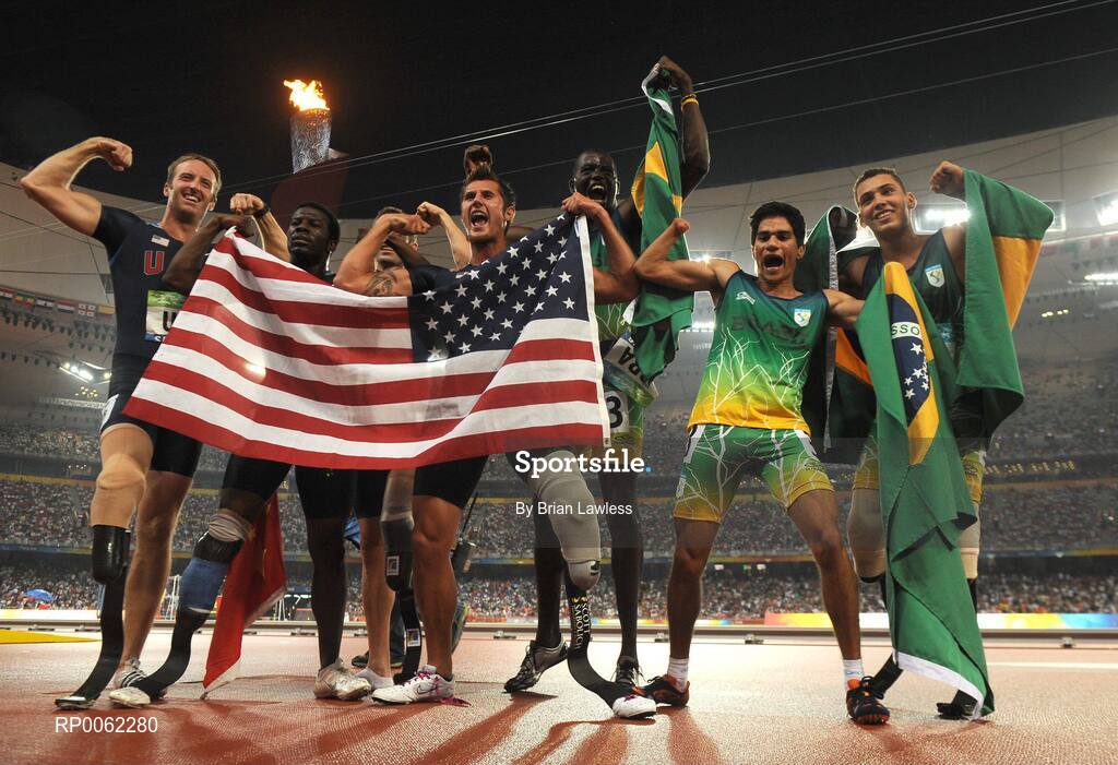16 September 2008; USA and Brazil athletes celebrate after finishing 1st and 2nd respectively in the Men's 4 X 100m Relay - T42-T46 Final. USA won in a world record time of 42.75. Beijing Paralympic Games 2008, 4 X 100m Relay - T42-T46 Final, National Stadium, Olympic Green, Beijing, China. Picture credit: Brian Lawless / SPORTSFILE