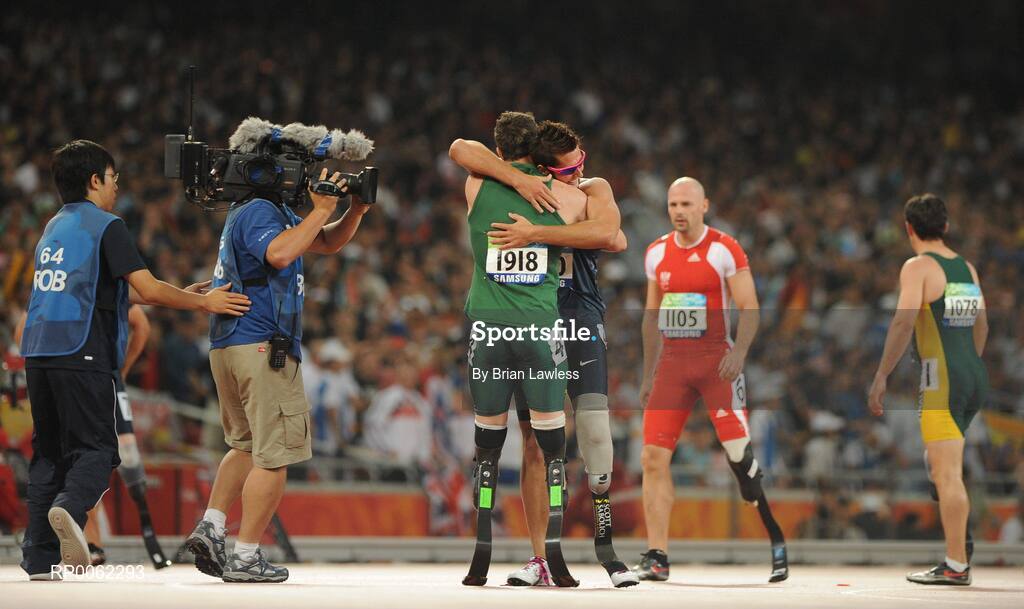 16 September 2008; South Africa's Oscar Pistorius is congratulated by USA's Jim Bob Bizzell, who finished second, after winning the Men's 400m T- 44 Final in a world record time of 47.49. Beijing Paralympic Games 2008, Men's 400m T- 44 Final, National Stadium, Olympic Green, Beijing, China. Picture credit: Brian Lawless / SPORTSFILE