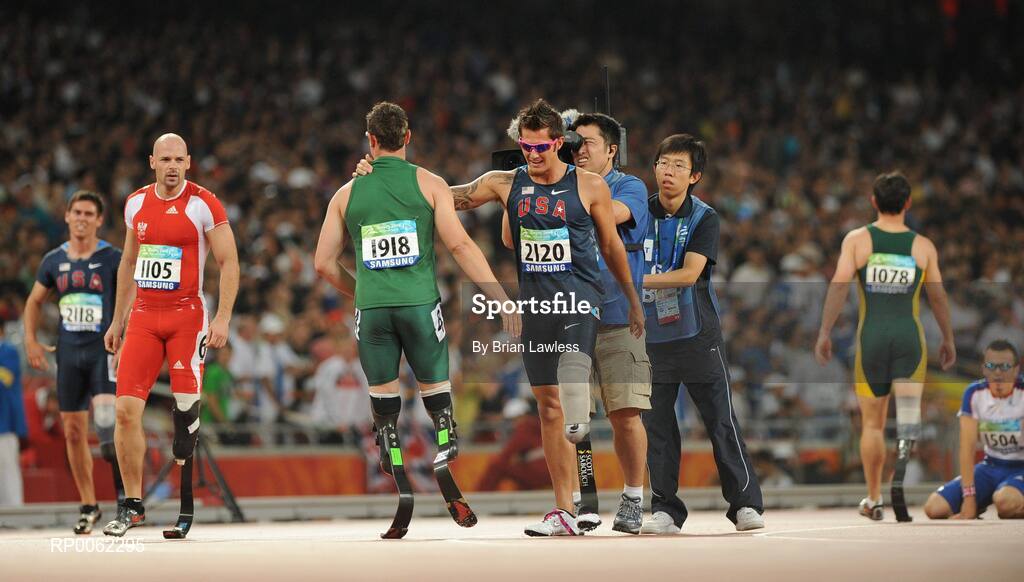 16 September 2008; South Africa's Oscar Pistorius is congratulated by USA's Jim Bob Bizzell, who finished second, after winning the Men's 400m T- 44 Final in a world record time of 47.49. Beijing Paralympic Games 2008, Men's 400m T- 44 Final, National Stadium, Olympic Green, Beijing, China. Picture credit: Brian Lawless / SPORTSFILE