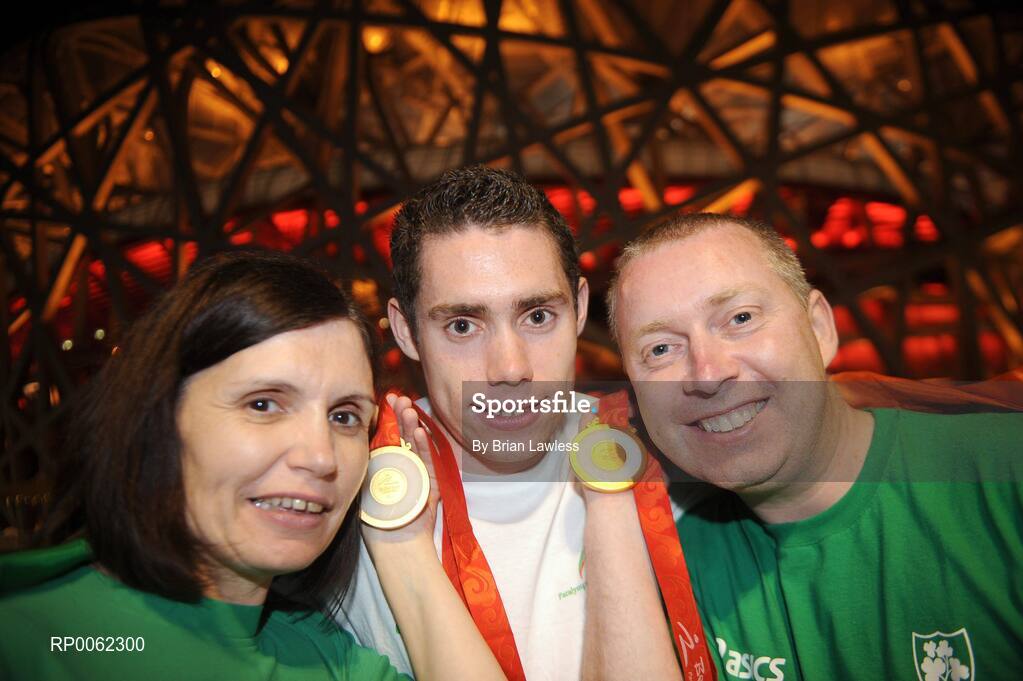16 September 2008; Ireland's Jason Smyth, from Eglinton, Co. Derry, with his mother Diane and father Lloyd outside the 'Bird's Nest' after the Men's 200m -T13 Final. Smyth won his second gold of these Paralympic games in a World record time of 21.43 seconds, his first coming in the Men's 100m T13 Final also in a world record time of 10.62. Beijing Paralympic Games 2008, Men's 200m -T13, Final, National Stadium, Olympic Green, Beijing, China. Picture credit: Brian Lawless / SPORTSFILE