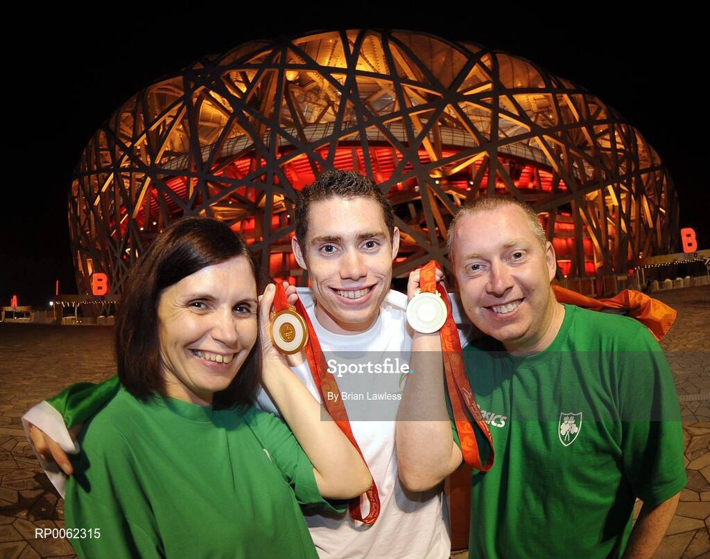16 September 2008; Ireland's Jason Smyth, from Eglinton, Co. Derry, with his mother Diane and father Lloyd outside the 'Bird's Nest' after the Men's 200m -T13 Final. Smyth won his second gold of these Paralympic games in a World record time of 21.43 seconds, his first coming in the Men's 100m T13 Final also in a world record time of 10.62. Beijing Paralympic Games 2008, Men's 200m -T13, Final, National Stadium, Olympic Green, Beijing, China. Picture credit: Brian Lawless / SPORTSFILE