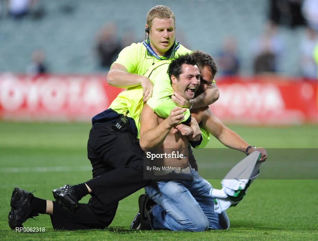24 October 2008; A supporter, who ran onto the pitch after the game, is caught by security personnel 2008 Toyota International Rules Series, Australia v Ireland, Subiaco Oval, Perth, Western Australia. Picture credit: Ray McManus / SPORTSFILE