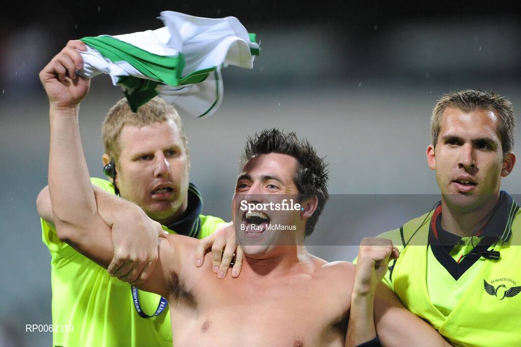 24 October 2008; A supporter is escorted off the field after the game. 2008 Toyota International Rules Series, Australia v Ireland, Subiaco Oval, Perth, Western Australia. Picture credit: Ray McManus / SPORTSFILE