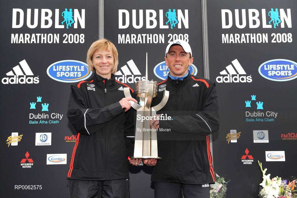 27 October 2008; The winners of the women's and men's races, Larissa Zousko, left, of the Russia and Andriy Naumov, of the Ukraine, with the Noel Carroll perpetual trophy during the Lifestyle Sports - adidas Dublin Marathon 2008. Merrion Square, Dublin. Picture credit: Brendan Moran / SPORTSFILE